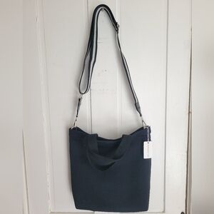 NWTs Black Neoprene Tote/Crossbody Bag. Comes w/2 straps & handles. Fits laptop!